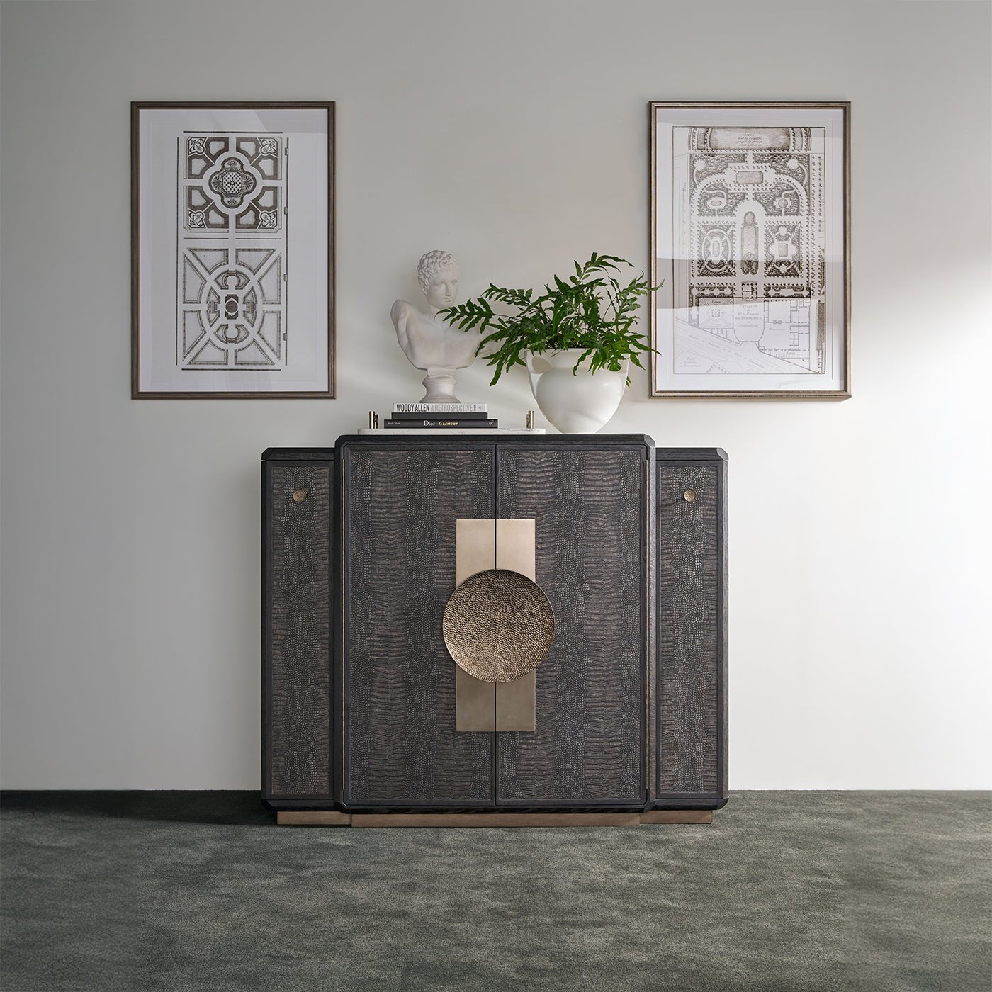 Black Art Deco Bar Cabinet styled between framed artwork.