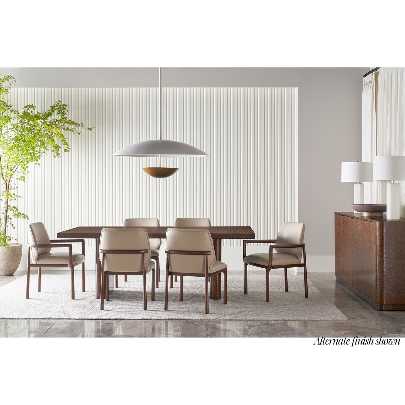 Dining room setup with black dining armchairs and table.