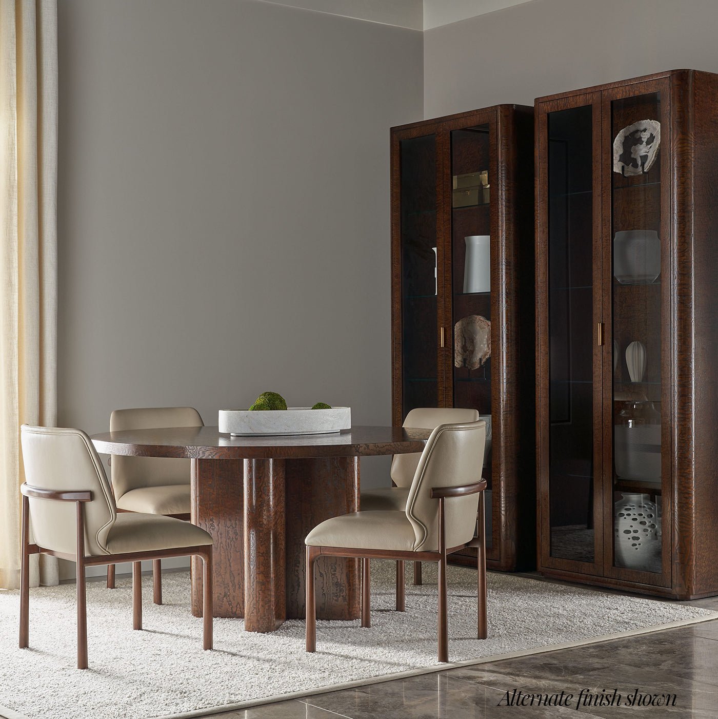 Dining room setup with Art Deco armchairs, table.
