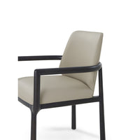 Close-up of Art Deco armchair side, leather detail.