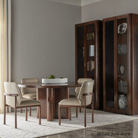 Dining chairs around wood table, modern dining room setting.