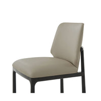Dining chair, close-up of angled backrest and seat.