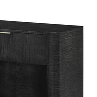 Close-up of black art deco nightstand corner detail.