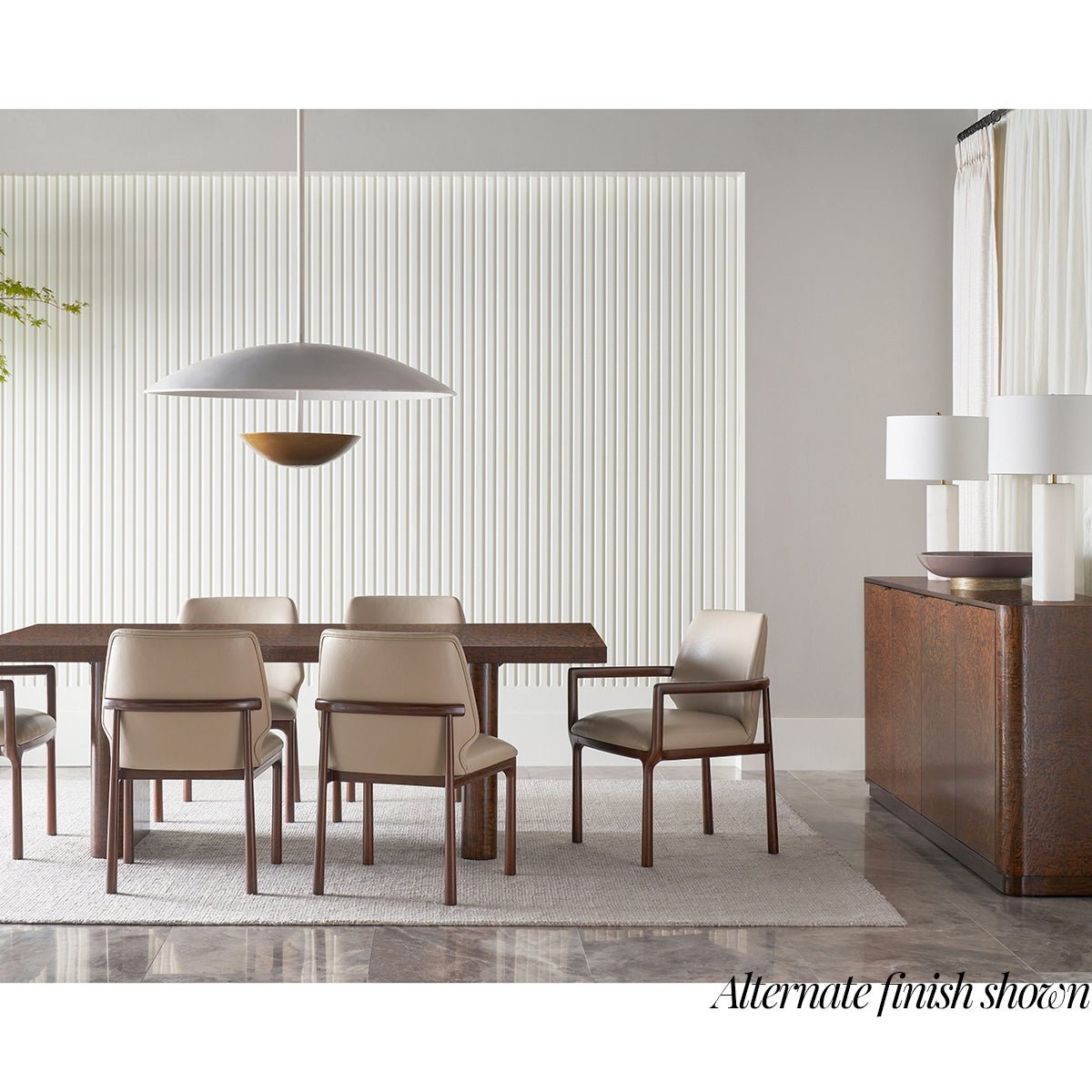 Sideboard with dining room furniture setup.