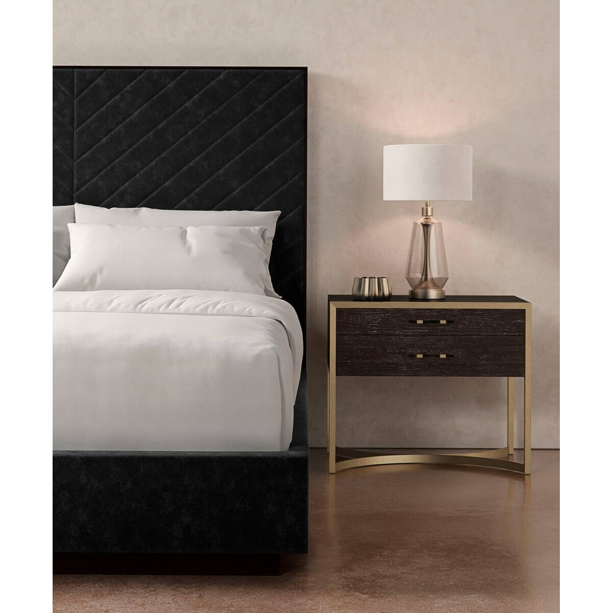 Partial view of king bed with nightstand and lamp.