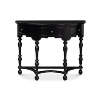 Front view of black console table with turned legs.