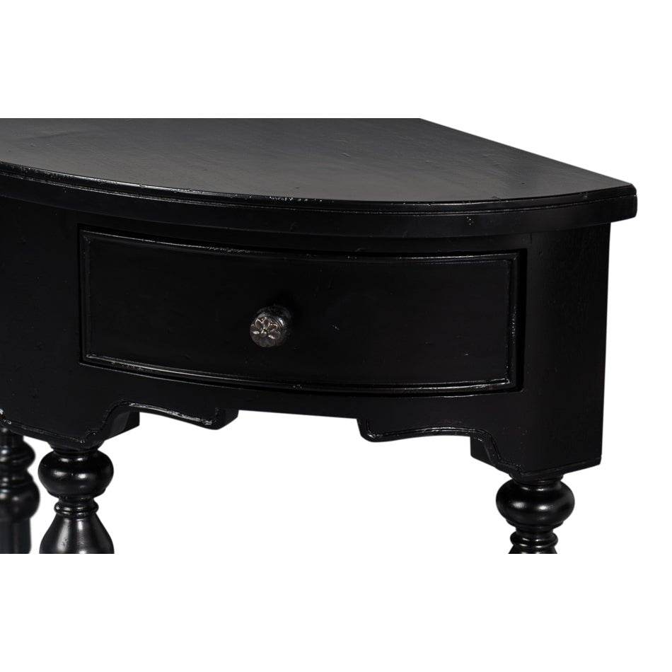 Detail of drawer with knob on black console table.