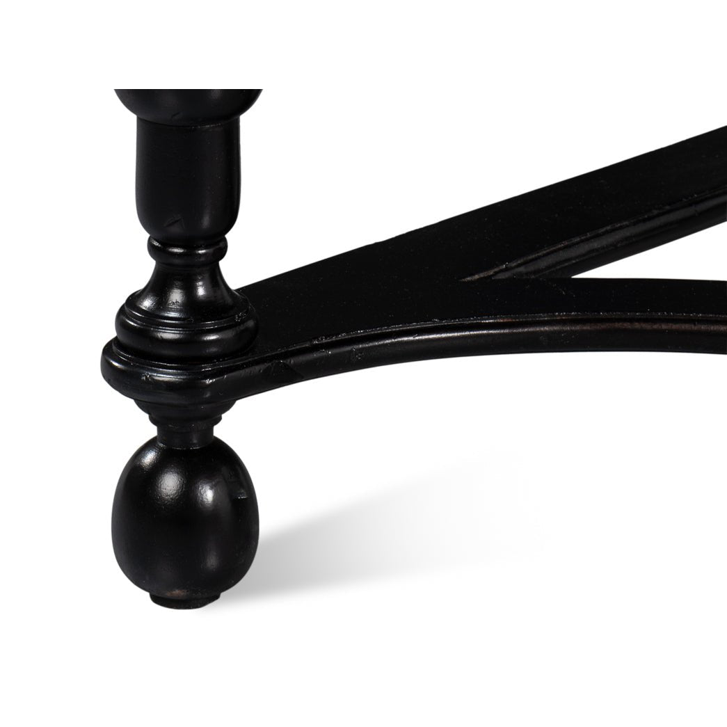 Console table's leg and foot design, close-up view.