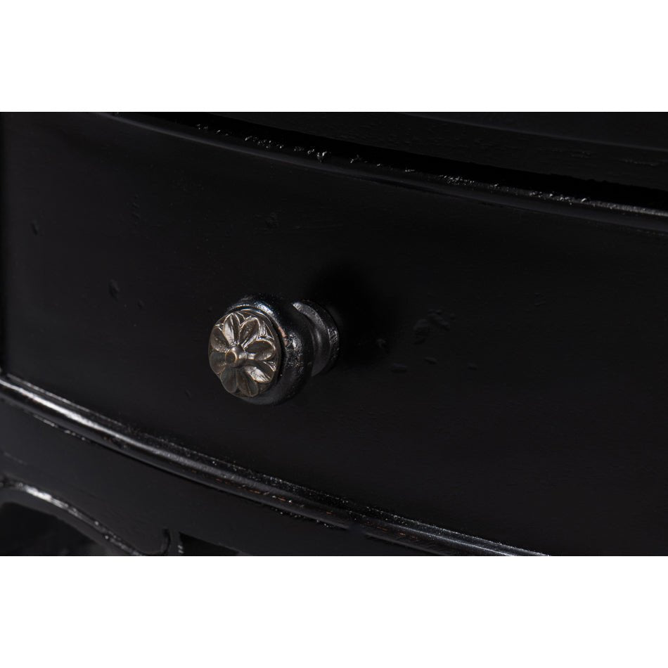 Drawer knob detail on black console table.