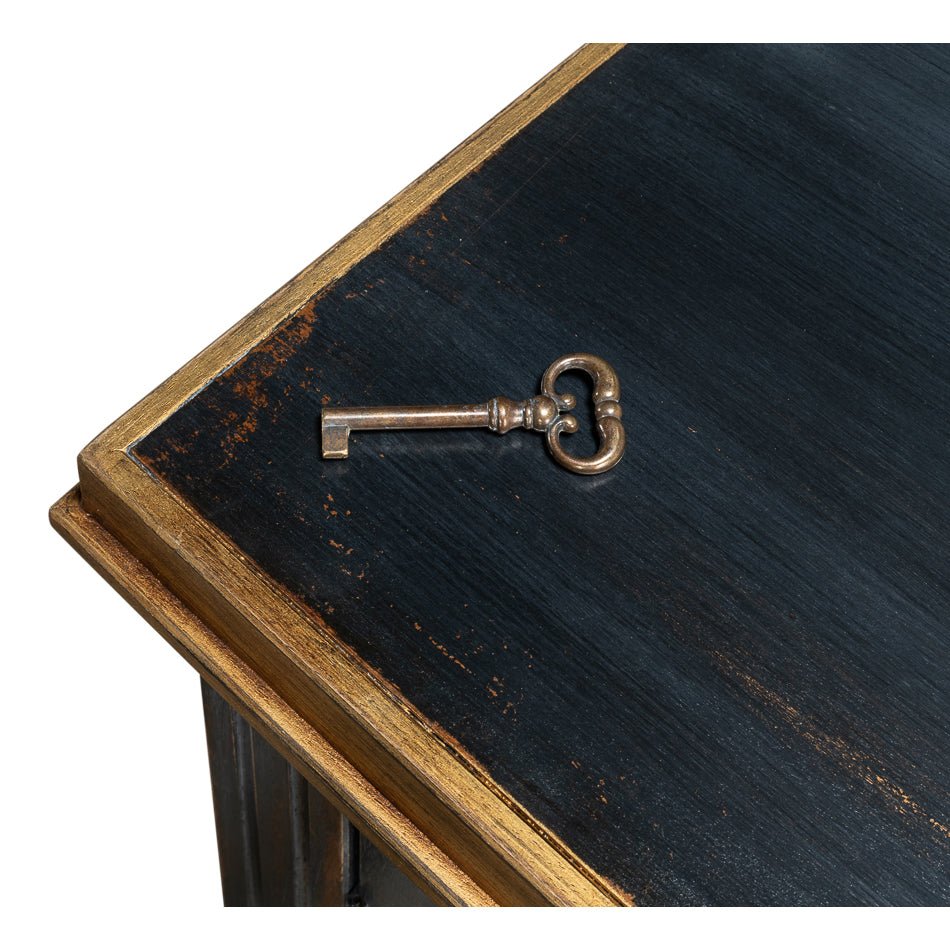 Black French sideboard top with decorative key.