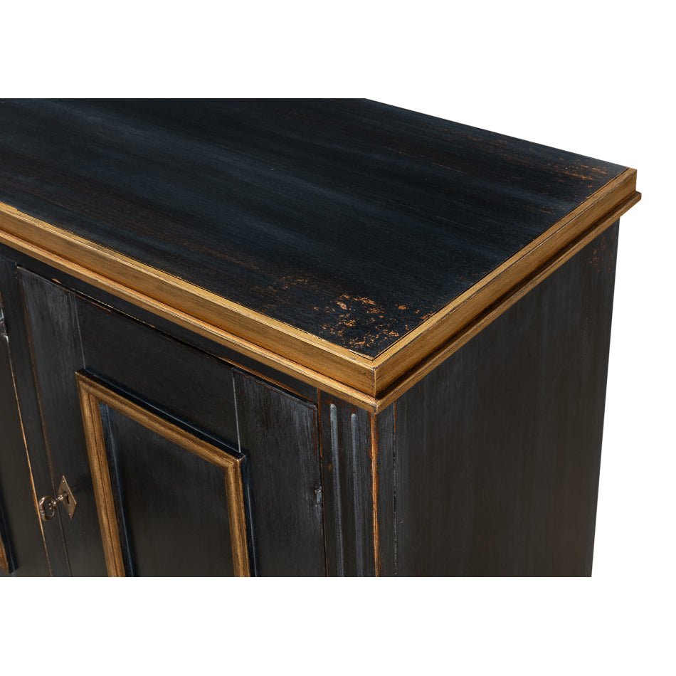 Close-up corner view of black French sideboard.