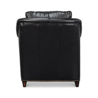 Back view of black leather accent chair with studs.