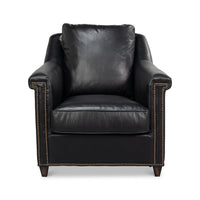Front view of black leather accent chair with studs.