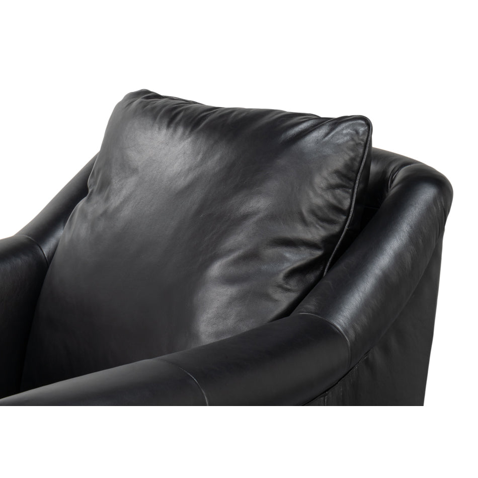 Cushion detail on black leather accent chair.