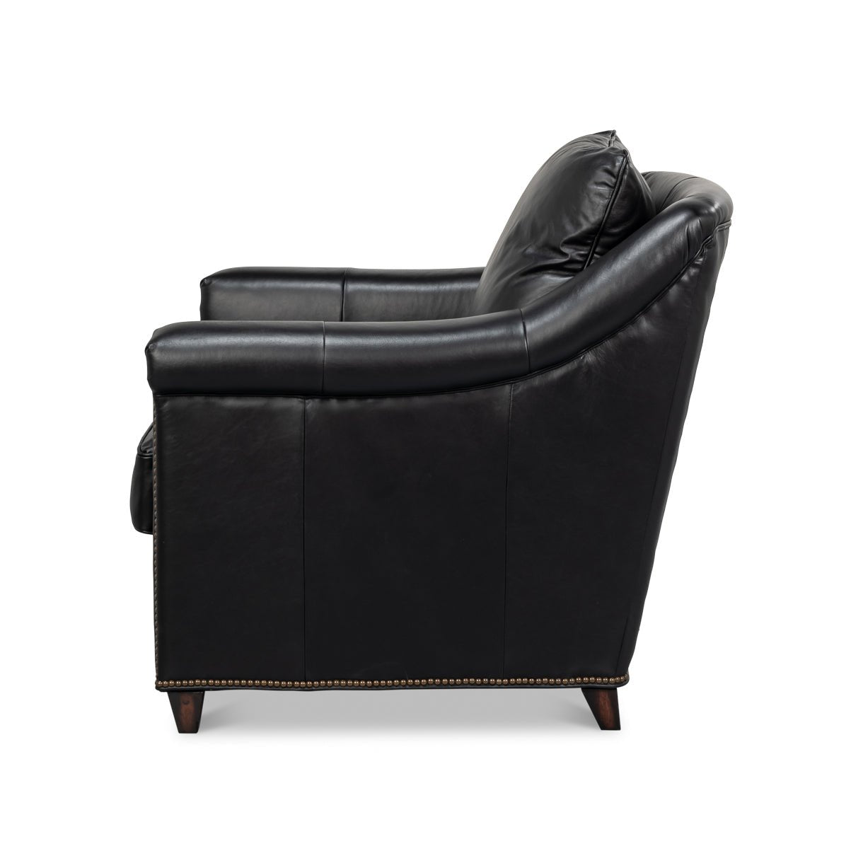 Side profile of black leather accent chair.