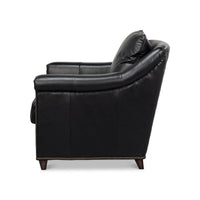 Side profile of black leather accent chair.