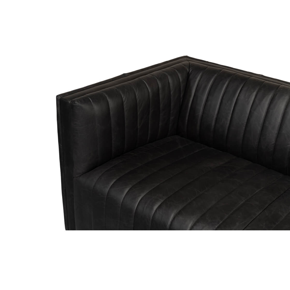 Black leather sofa corner view, plush seating.