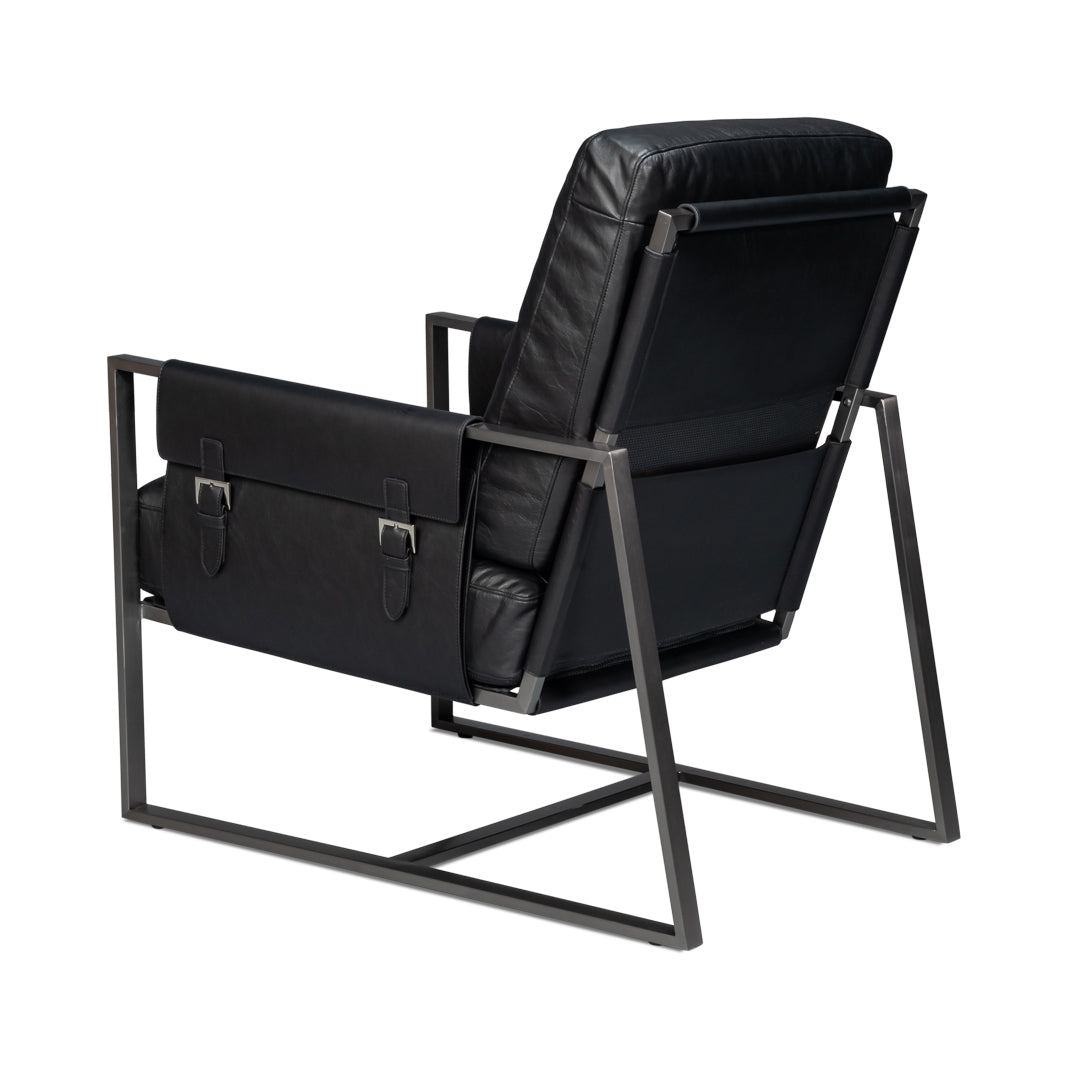 Black leather accent chair, angled rear-left view.
