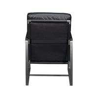 Black leather accent chair, rear view.