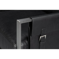 Close-up buckle detail, black leather accent chair.