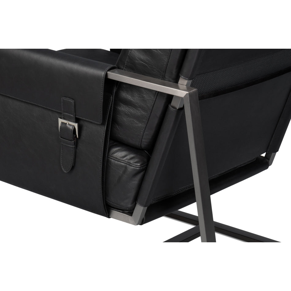 Side and backrest detail, black leather accent chair.