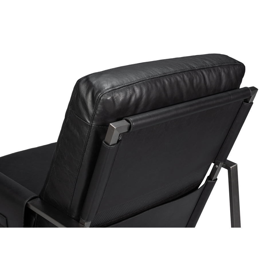 Backrest close-up, black leather accent chair.