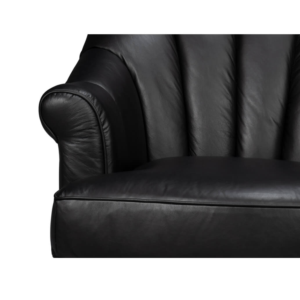 Close-up of swivel chair arm, black leather detail.