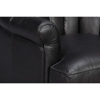 Armrest and seat detail of black leather swivel chair.
