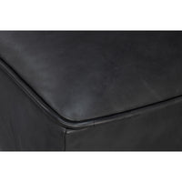Close-up of armrest stitching on slipper chair.