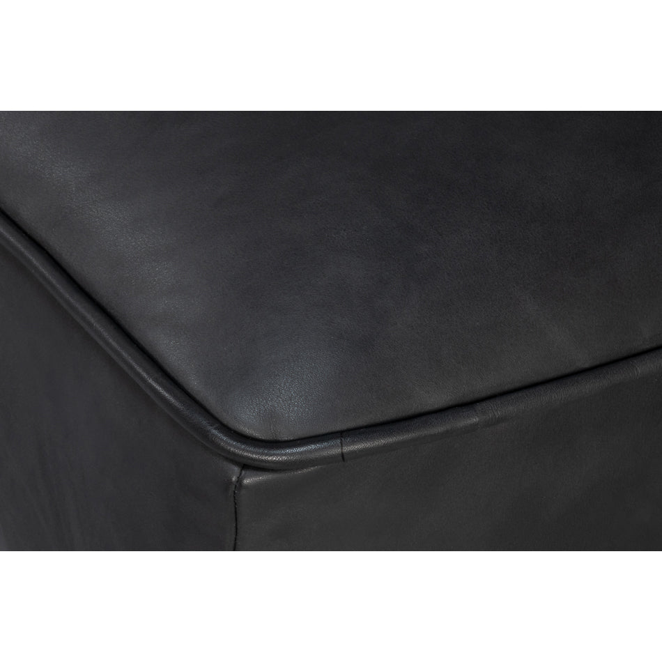 Close-up of armrest stitching on slipper chair.