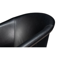Black leather tub chair armrest curve.