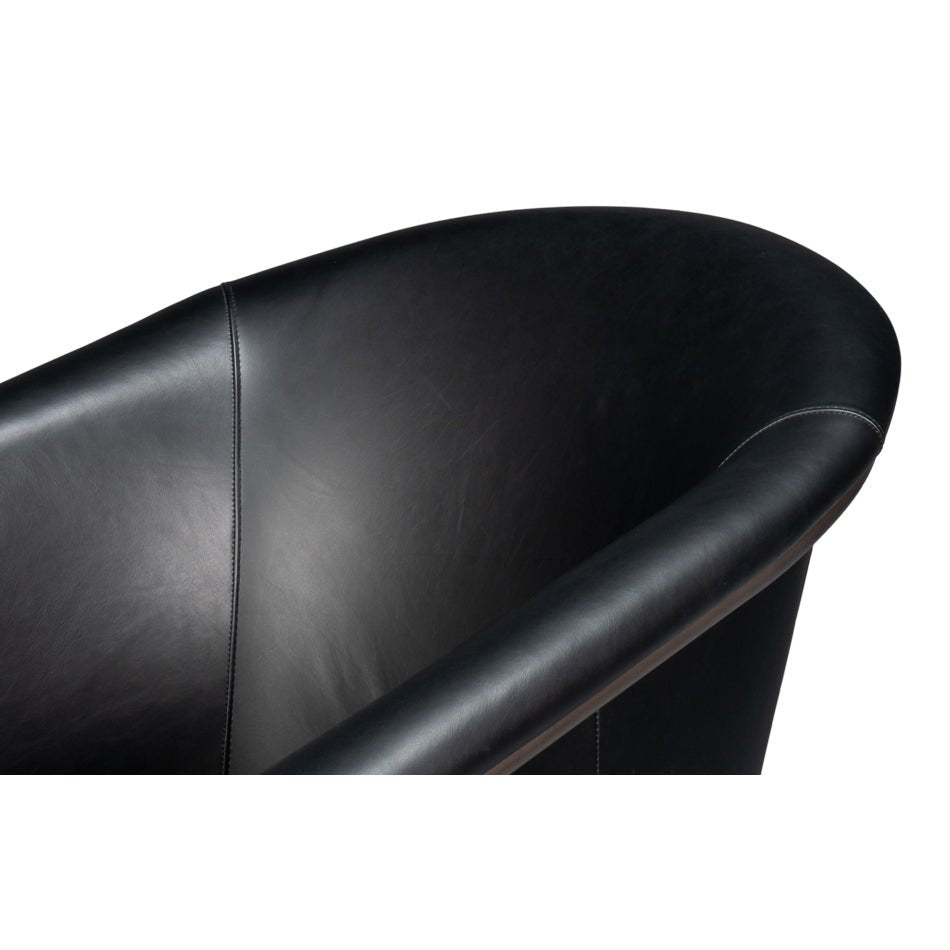 Black leather tub chair armrest curve.