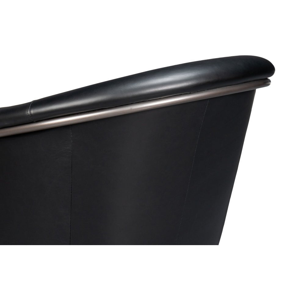 Black leather tub chair backrest detail.