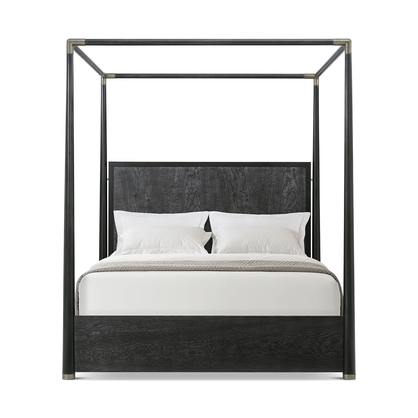 Front view of black canopy bed with pillows.