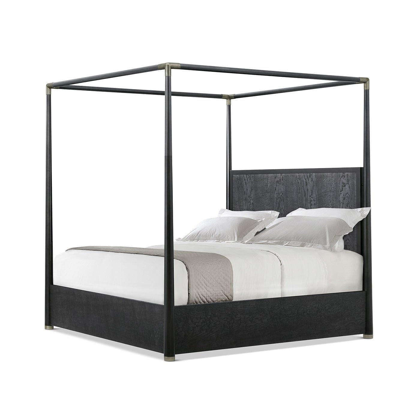 Black canopy bed side angle with white bedding.