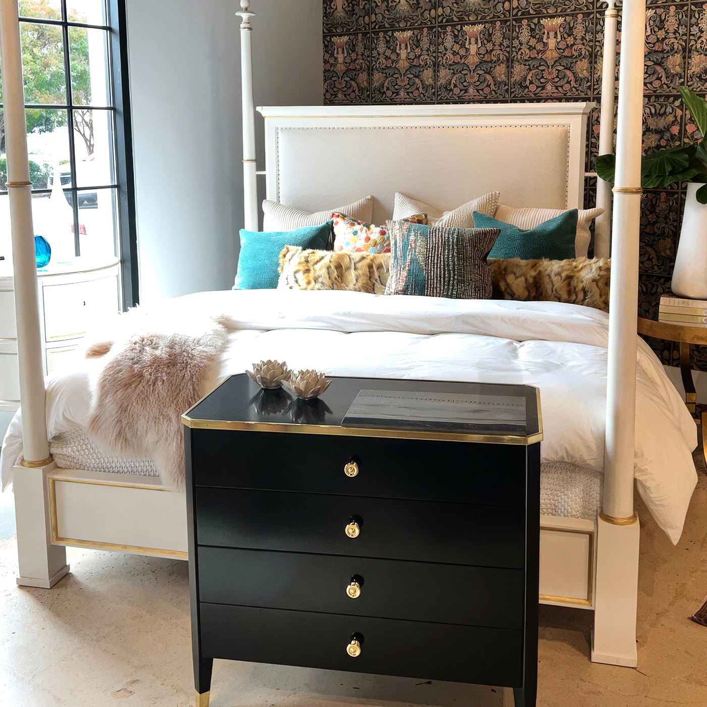 Black mid-century nightstand in stylish bedroom setting.