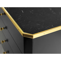 Black mid-century nightstand corner detail with gold edge.