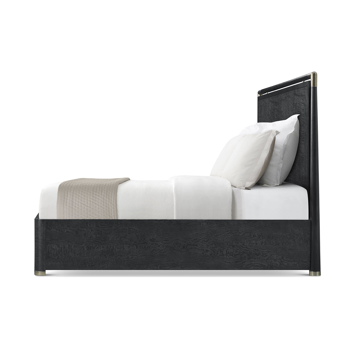 Side profile of black mid-century bed, white sheets.