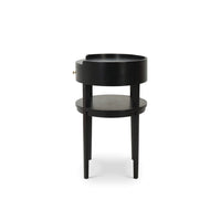 Black oval side table profile view.