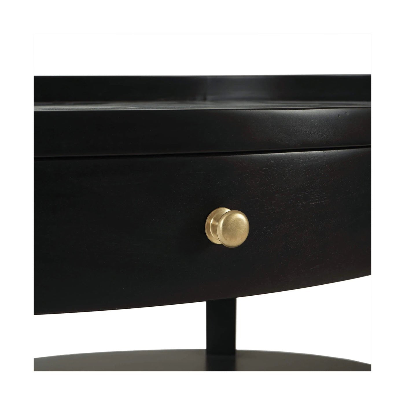 Close-up of drawer knob on black oval side table.