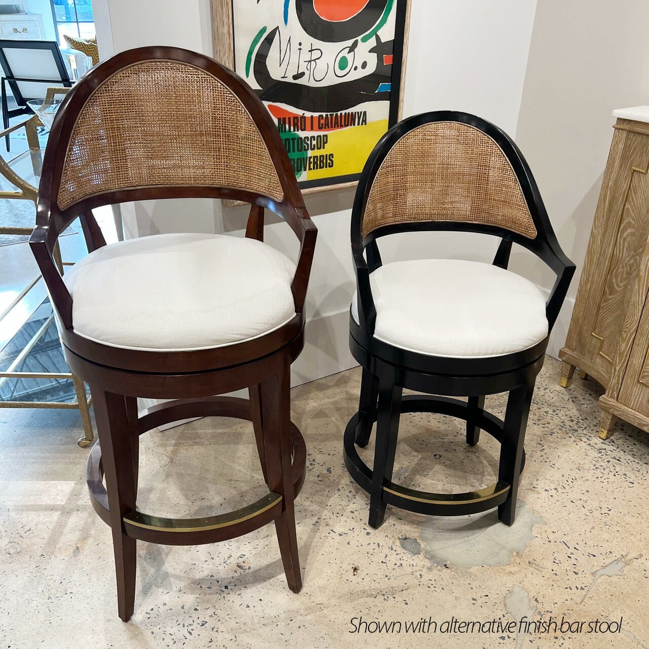 Black and brown counter stools in styled interior setting.
