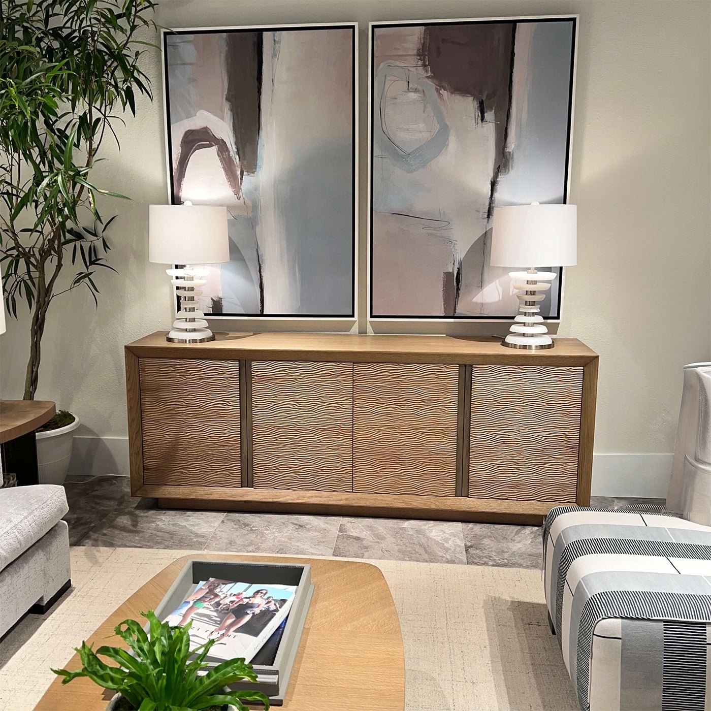 Media cabinet styled in living room with modern decor.