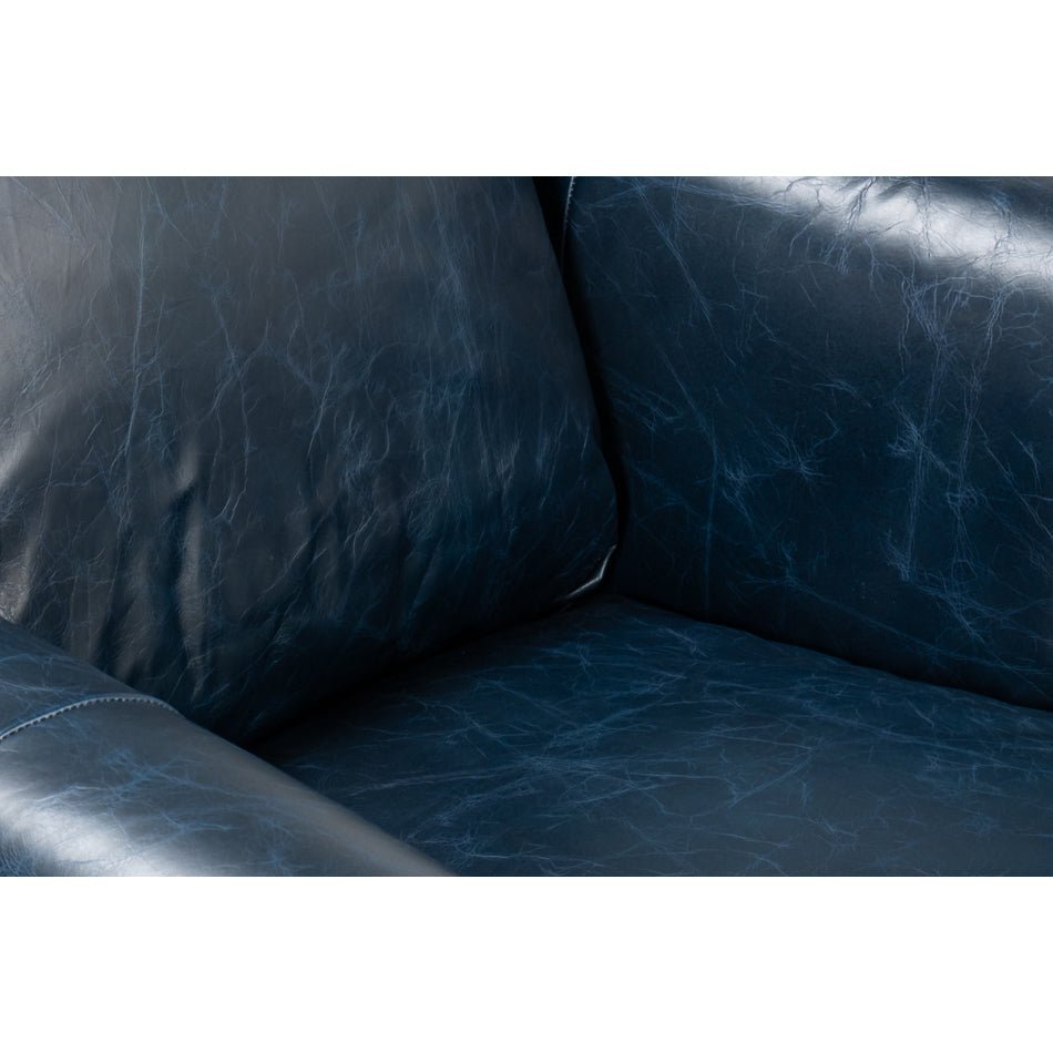 Seat detail of blue leather accent chair