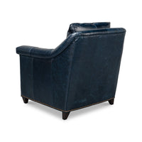 Rear left angle view of blue leather accent chair