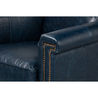 Close-up of chair arm with nailhead trim