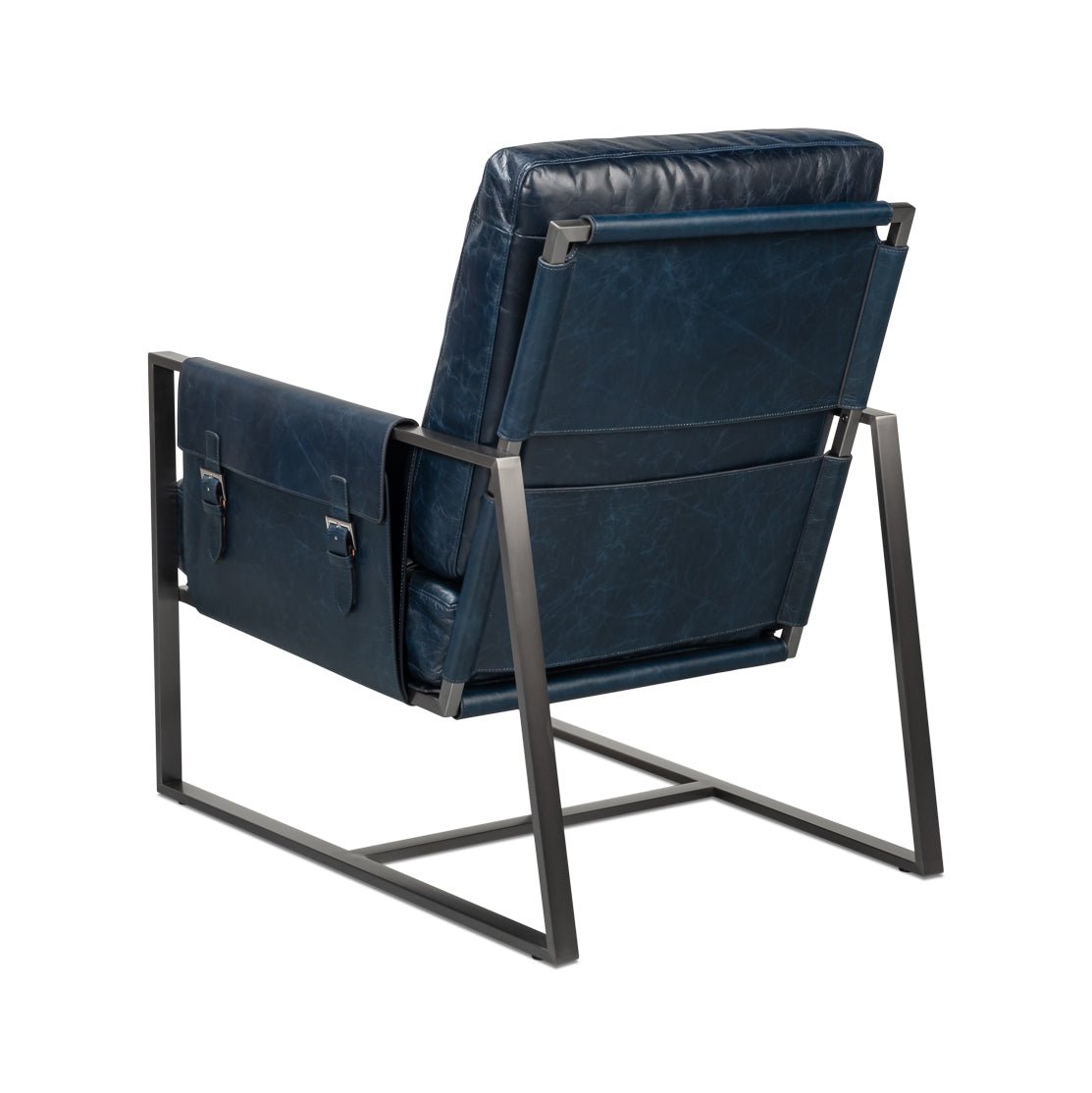 Blue leather accent chair, angled back view.
