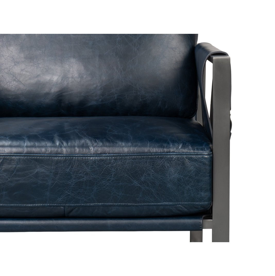 Close-up of blue leather seat, accent chair.