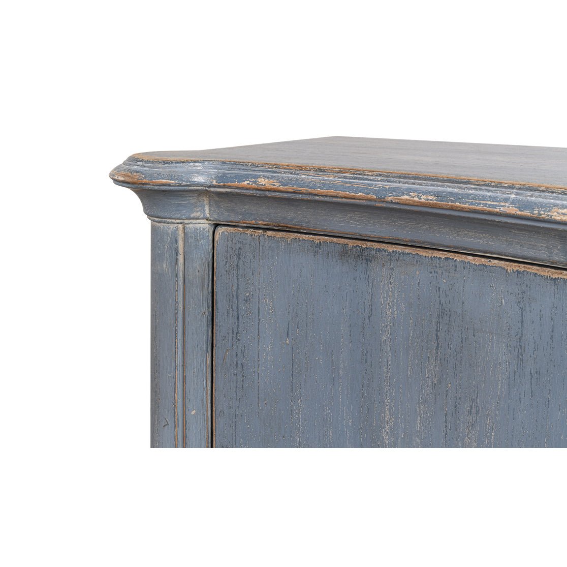 Corner edge detail of blue sideboard.