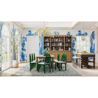 Dining room with green chairs, kitchen island included.