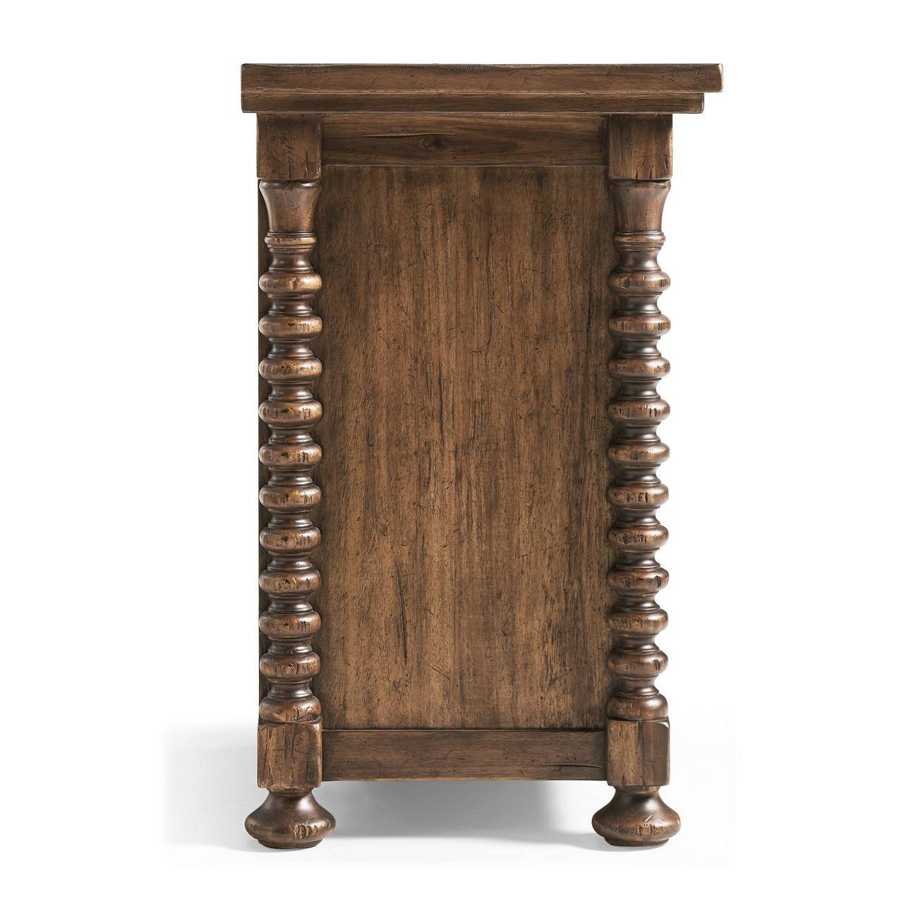 Side view of wooden nightstand with detailed legs.
